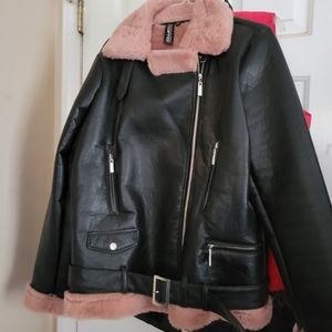 Faux leather jacket with pink lining